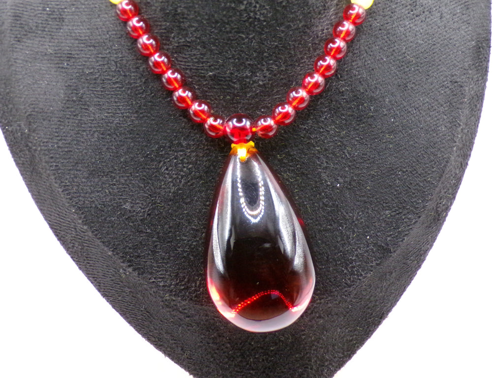 Red Bead Necklace with Dark Teardrop Pendant
