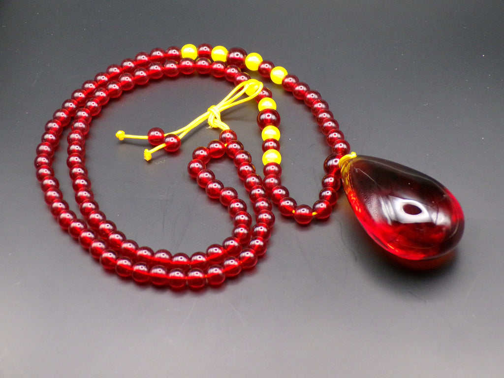 Red Bead Necklace with Dark Teardrop Pendant