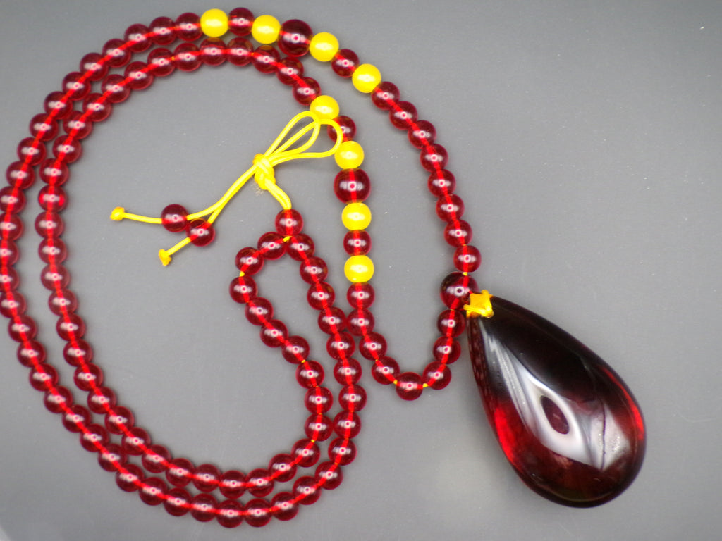 Red Bead Necklace with Dark Teardrop Pendant